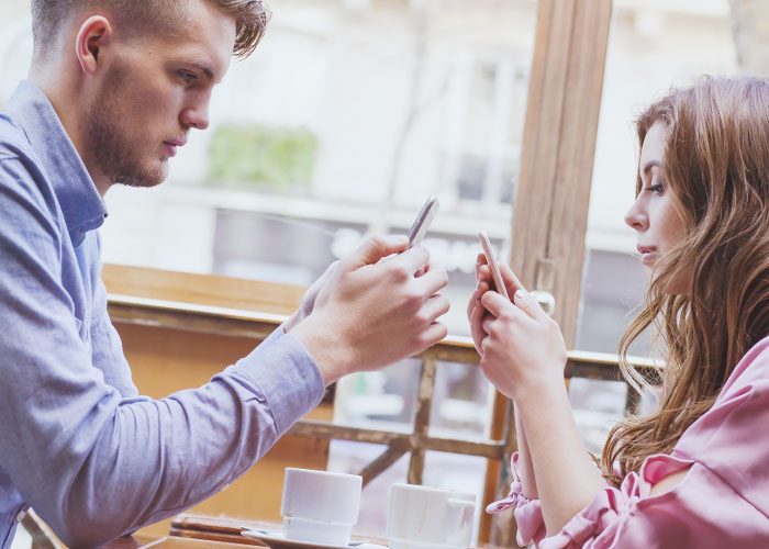 couple with phones